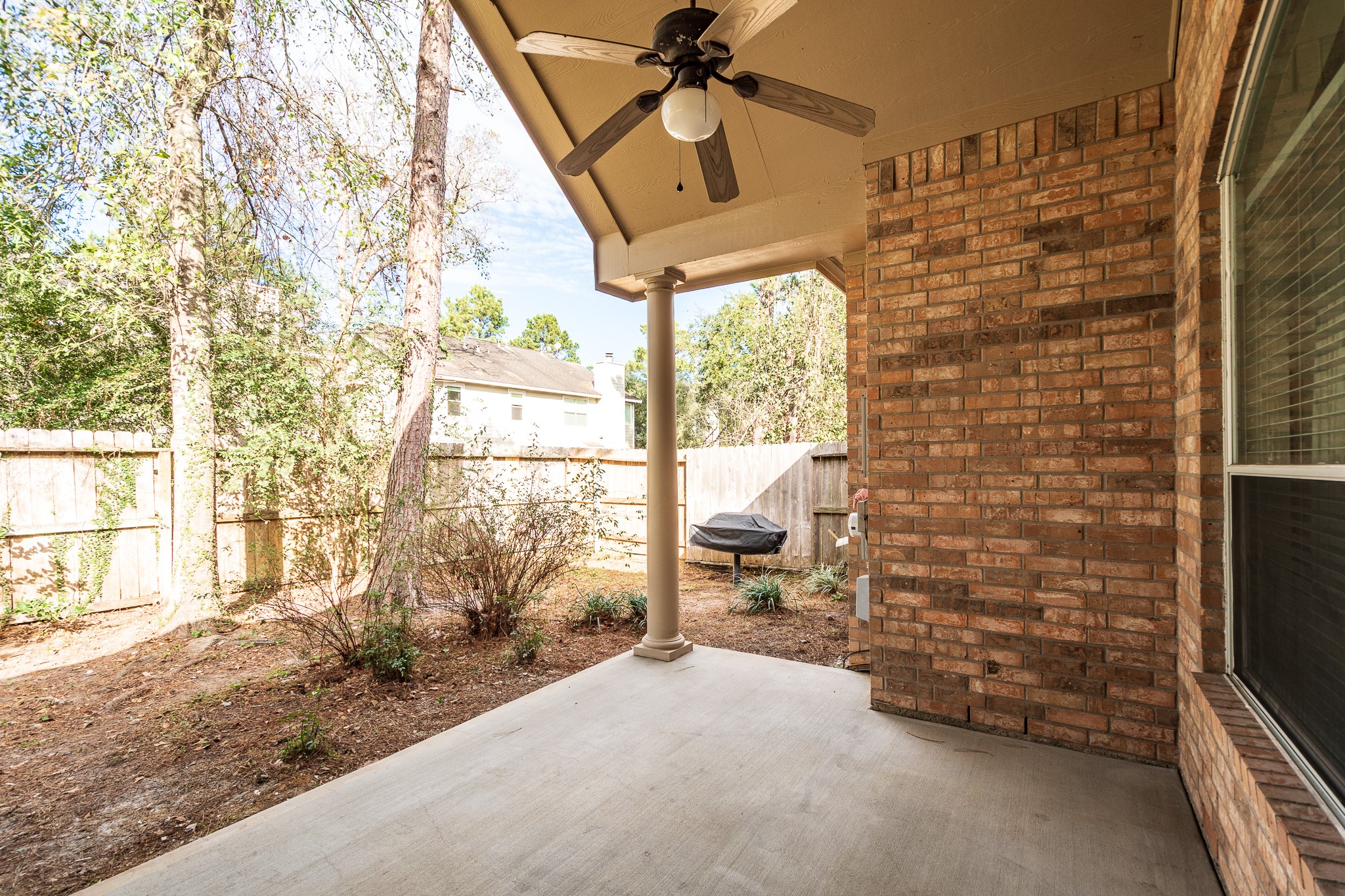 43 North Belfair Place Spring, TX 77382 - Photo 29 of 36 a view of open door and trees in the background