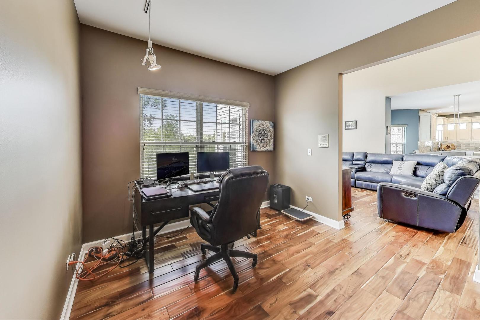 17119 West Prairieview Lane Gurnee, IL 60031 - Photo 13 of 40 a view of a workspace with furniture and a window