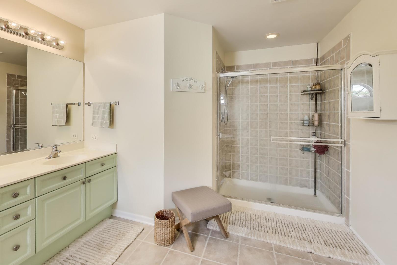 17119 West Prairieview Lane Gurnee, IL 60031 - Photo 21 of 40 a bathroom with a bathtub shower sink and toilet