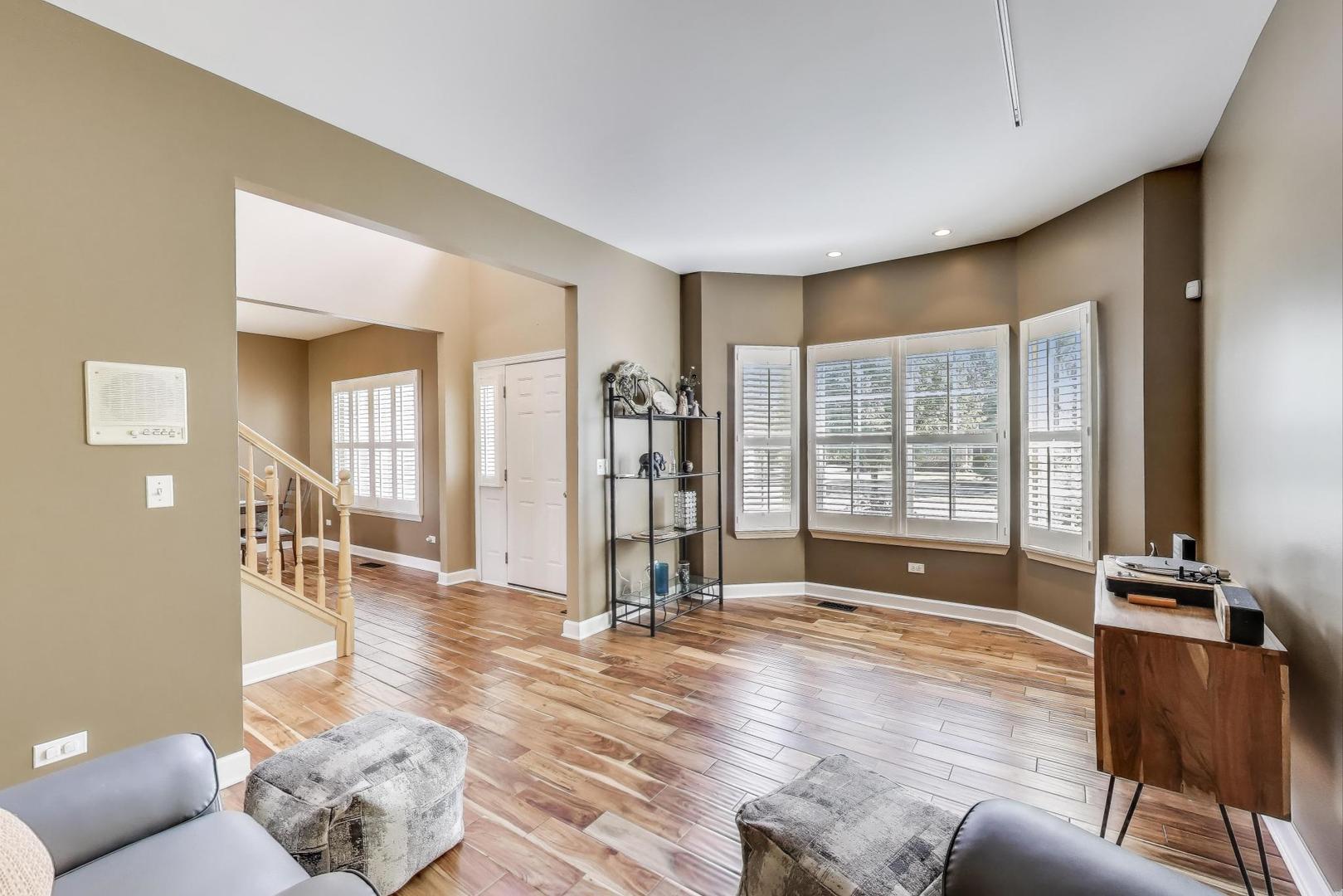 17119 West Prairieview Lane Gurnee, IL 60031 - Photo 3 of 40 a view of livingroom with furniture and wooden floor