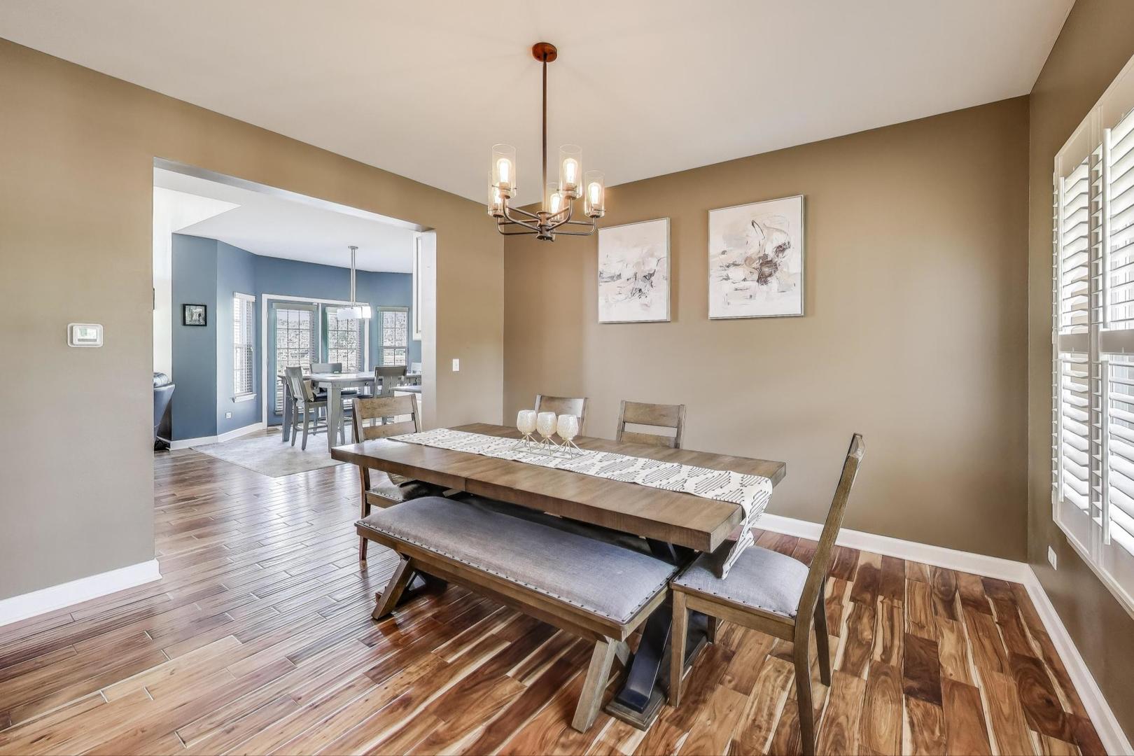 17119 West Prairieview Lane Gurnee, IL 60031 - Photo 5 of 40 a view of a dining room with furniture window and wooden floor