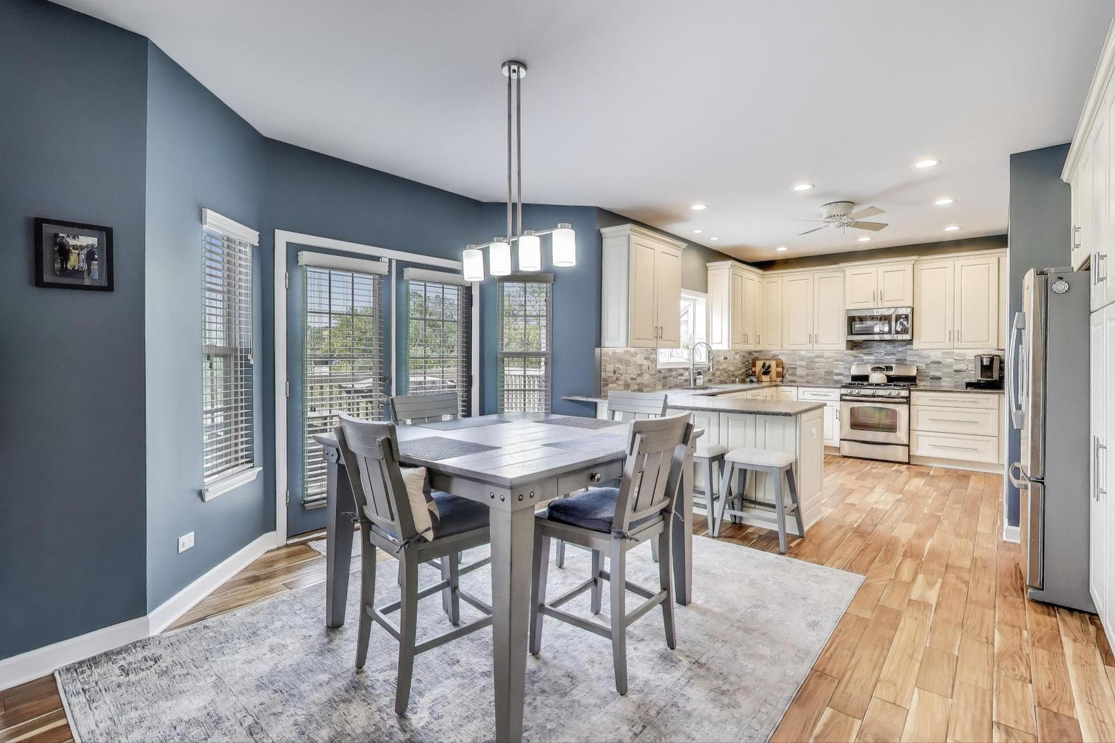 17119 West Prairieview Lane Gurnee, IL 60031 - Photo 10 of 40 a view of a dining room with furniture window and wooden floor