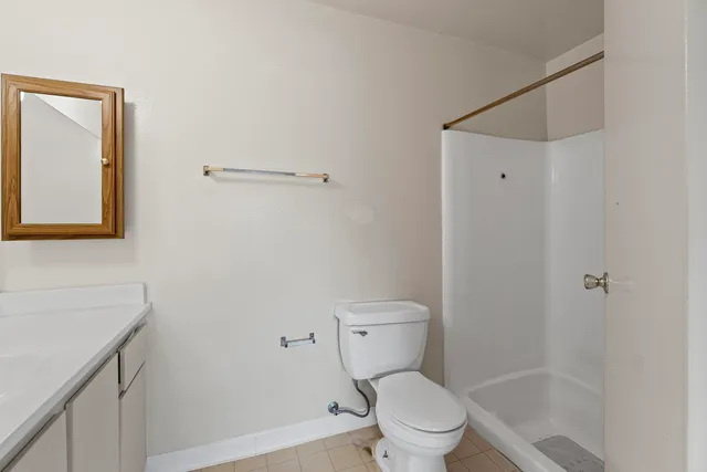 a view of an empty room and a window