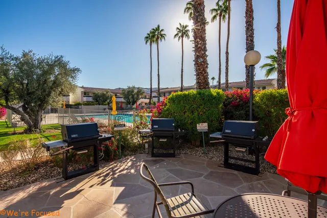 a view of a swimming pool with a patio