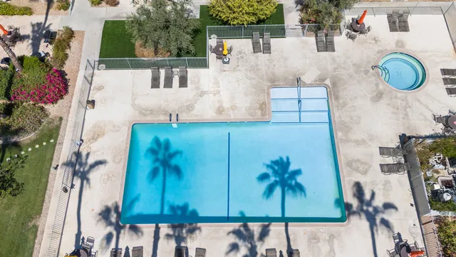 swimming pool view with a outdoor seating space