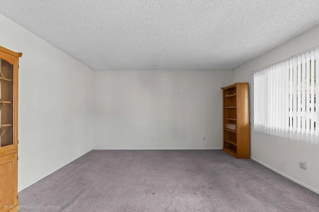 a kitchen with a sink and a stove top oven
