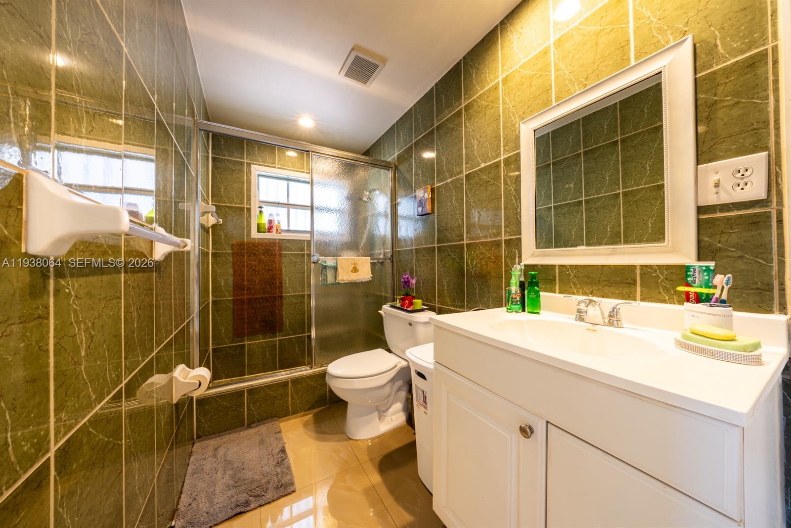 1937 Southwest 57th Court Miami, FL 33155 - Photo 18 of 23 a bathroom with a sink toilet and shower