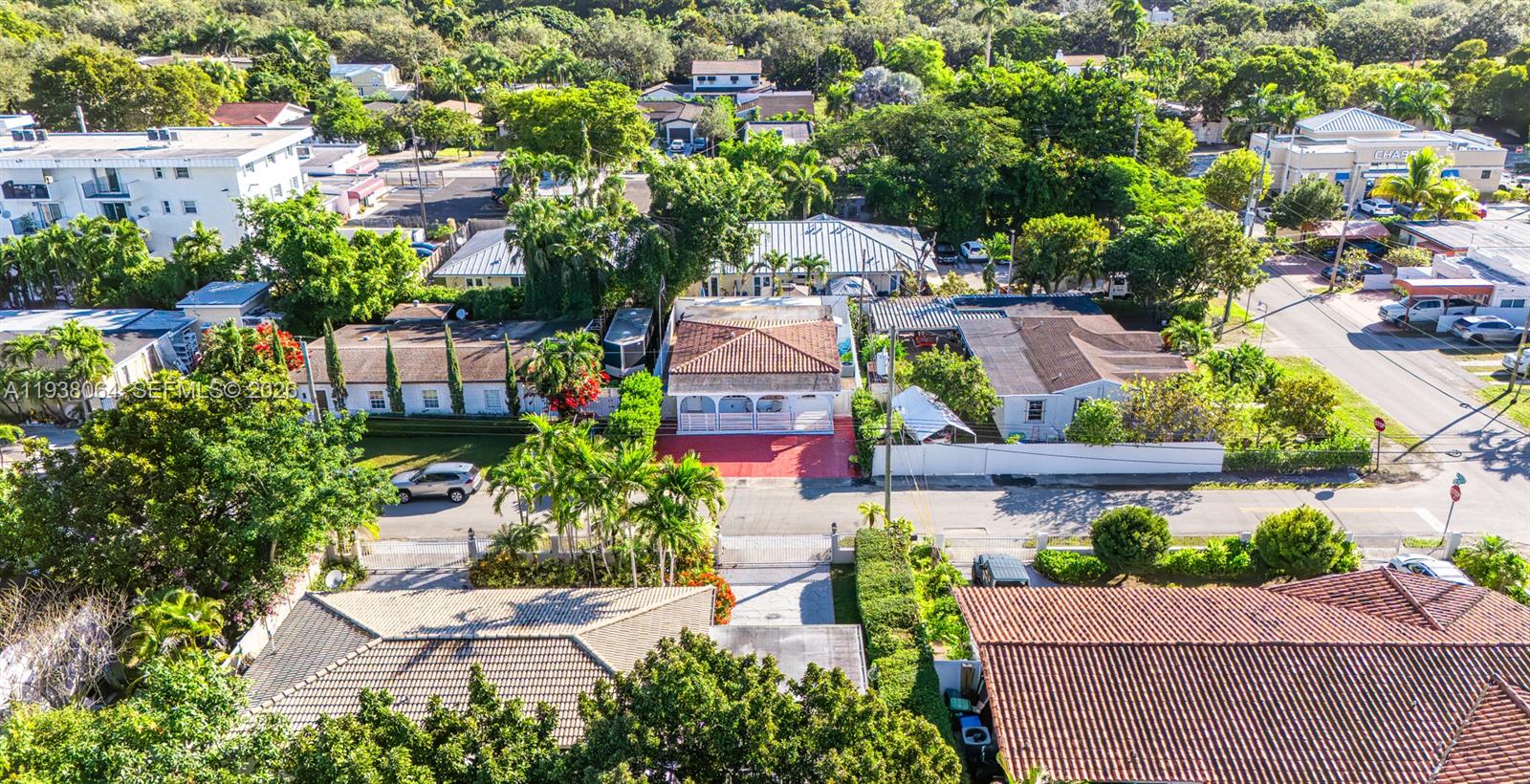 1937 Southwest 57th Court Miami, FL 33155 - Photo 6 of 23 an aerial view of a house with a yard and garden