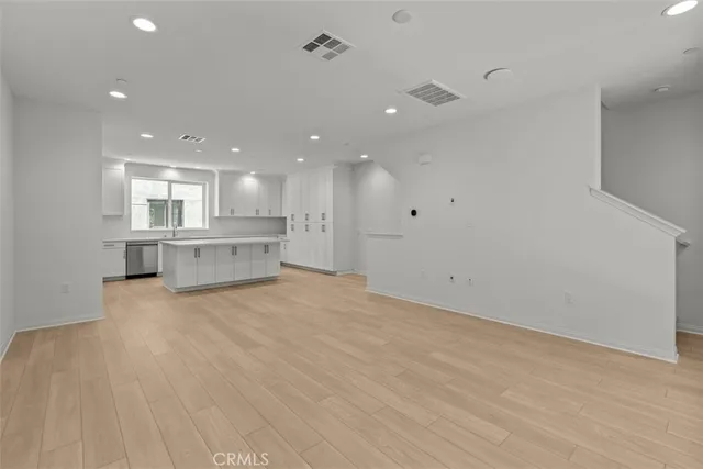 a view of a kitchen with a sink and a stove top oven