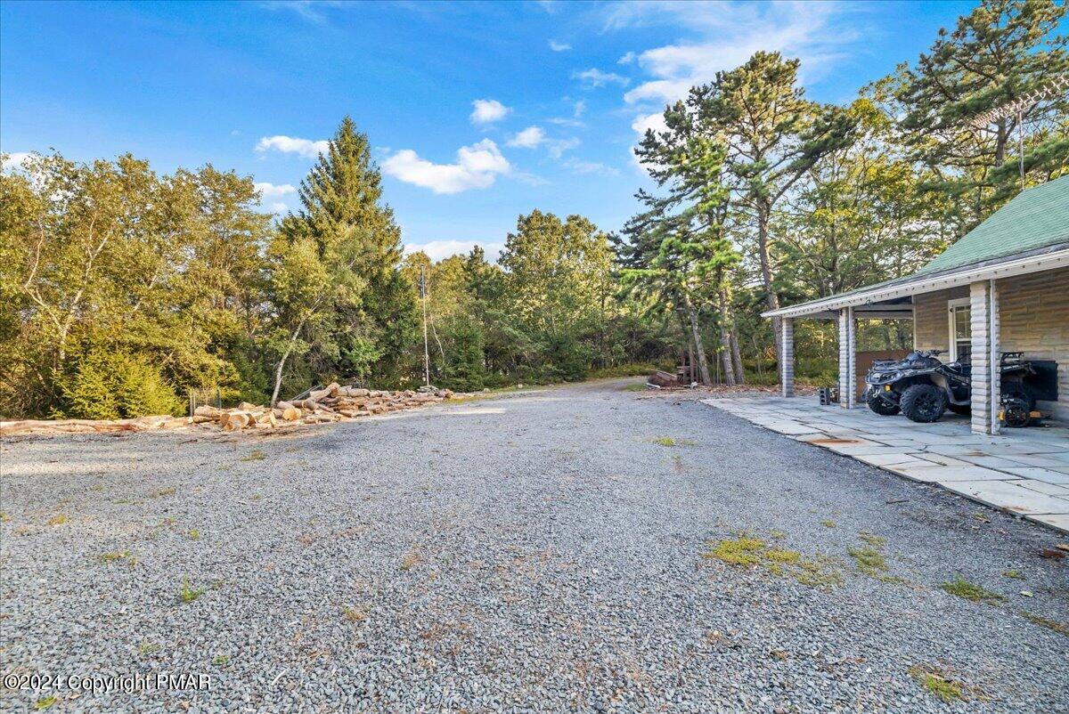 190 Knob Road Mount Pocono, PA 18344 - Photo 12 of 37 a view of a house with backyard and a tree