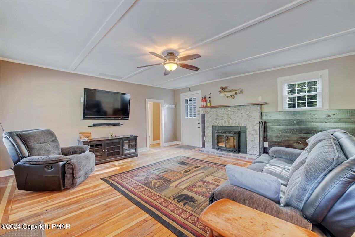 190 Knob Road Mount Pocono, PA 18344 - Photo 27 of 37 a living room with furniture a flat screen tv and a fireplace