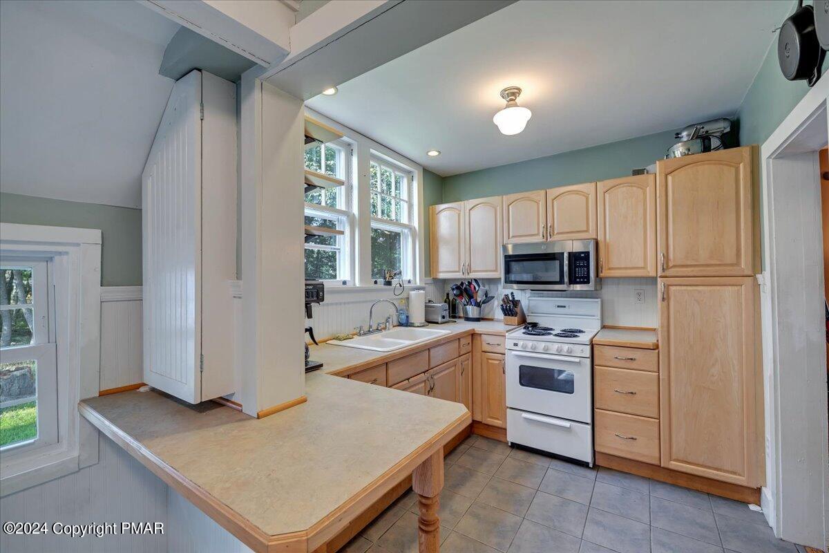 190 Knob Road Mount Pocono, PA 18344 - Photo 30 of 37 a kitchen with cabinets and wooden floor