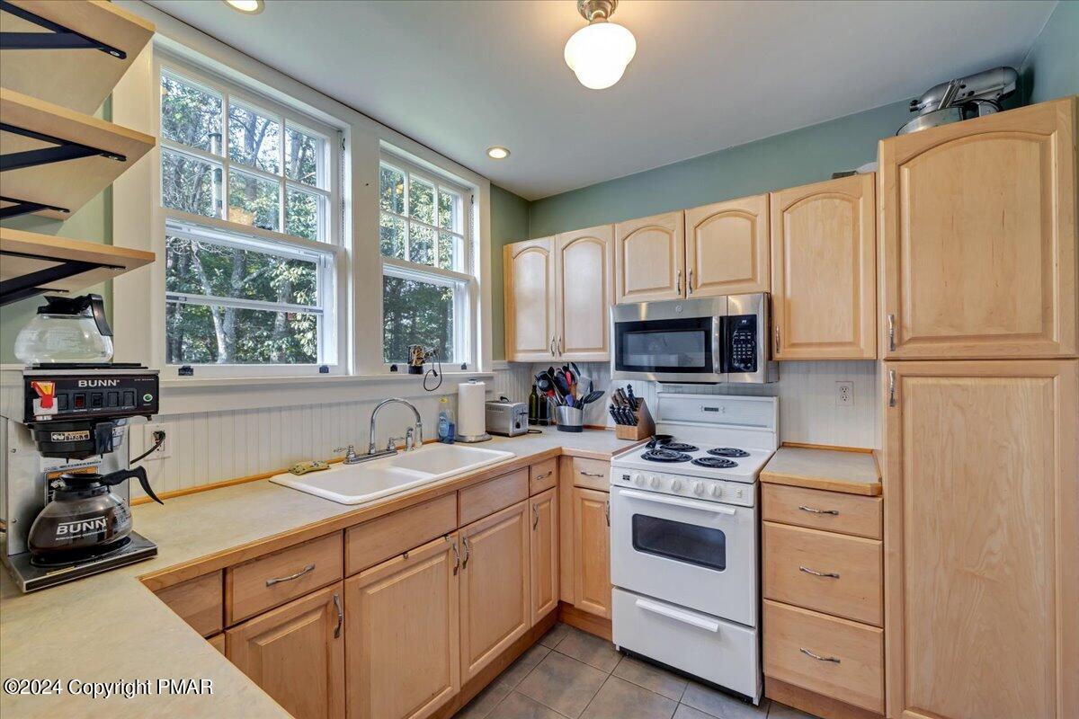 190 Knob Road Mount Pocono, PA 18344 - Photo 31 of 37 a kitchen with stainless steel appliances white cabinets and a sink