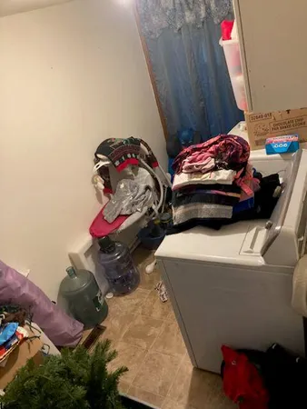 a bedroom with a bed and a dresser