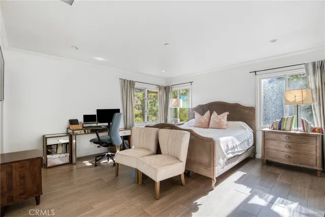 a bedroom with a bed and a couch