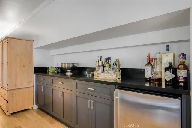 a kitchen with sink and cabinets