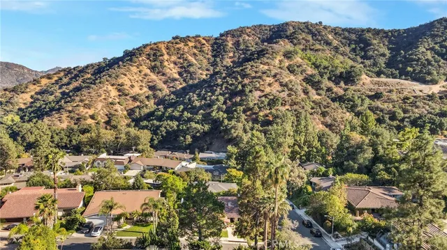 an aerial view of residential building with green space