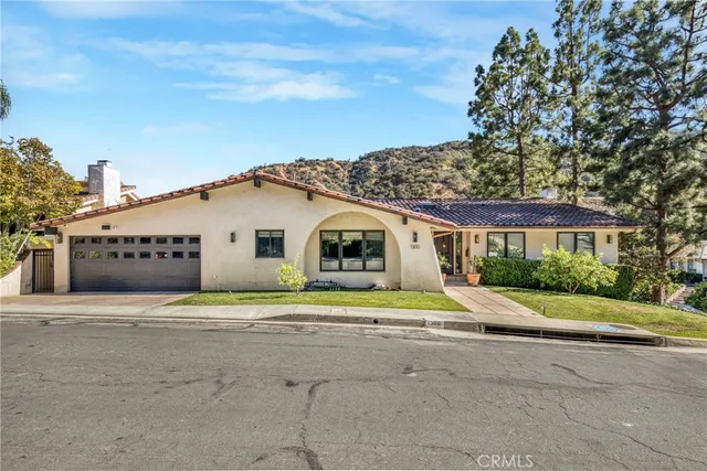 a house with trees in front of it