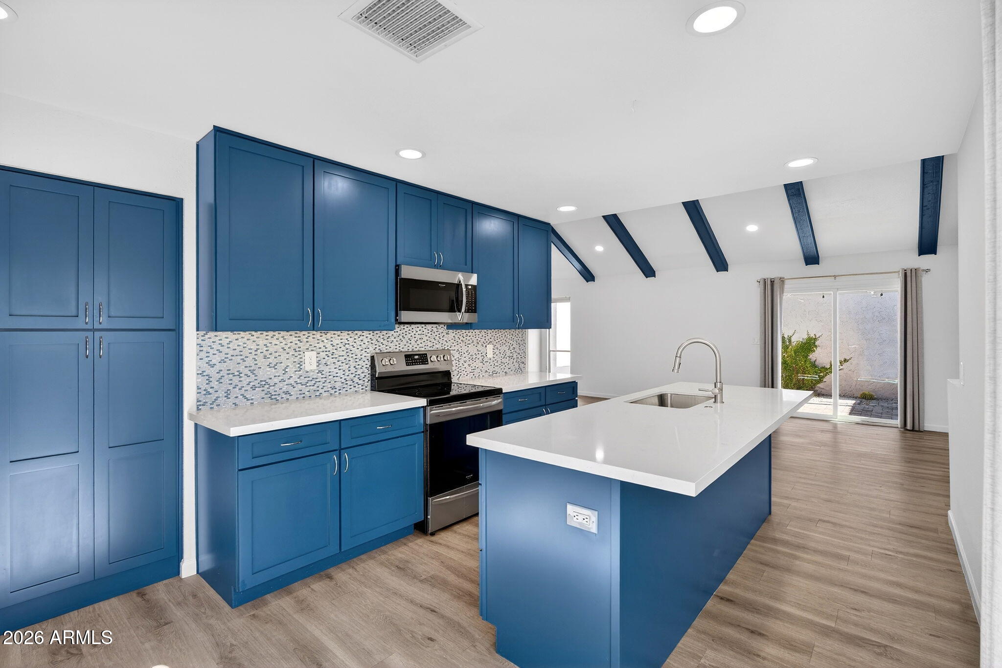 330 East Embassy Street Tempe, AZ 85288 - Photo 12 of 68 a kitchen with a sink stove and microwave