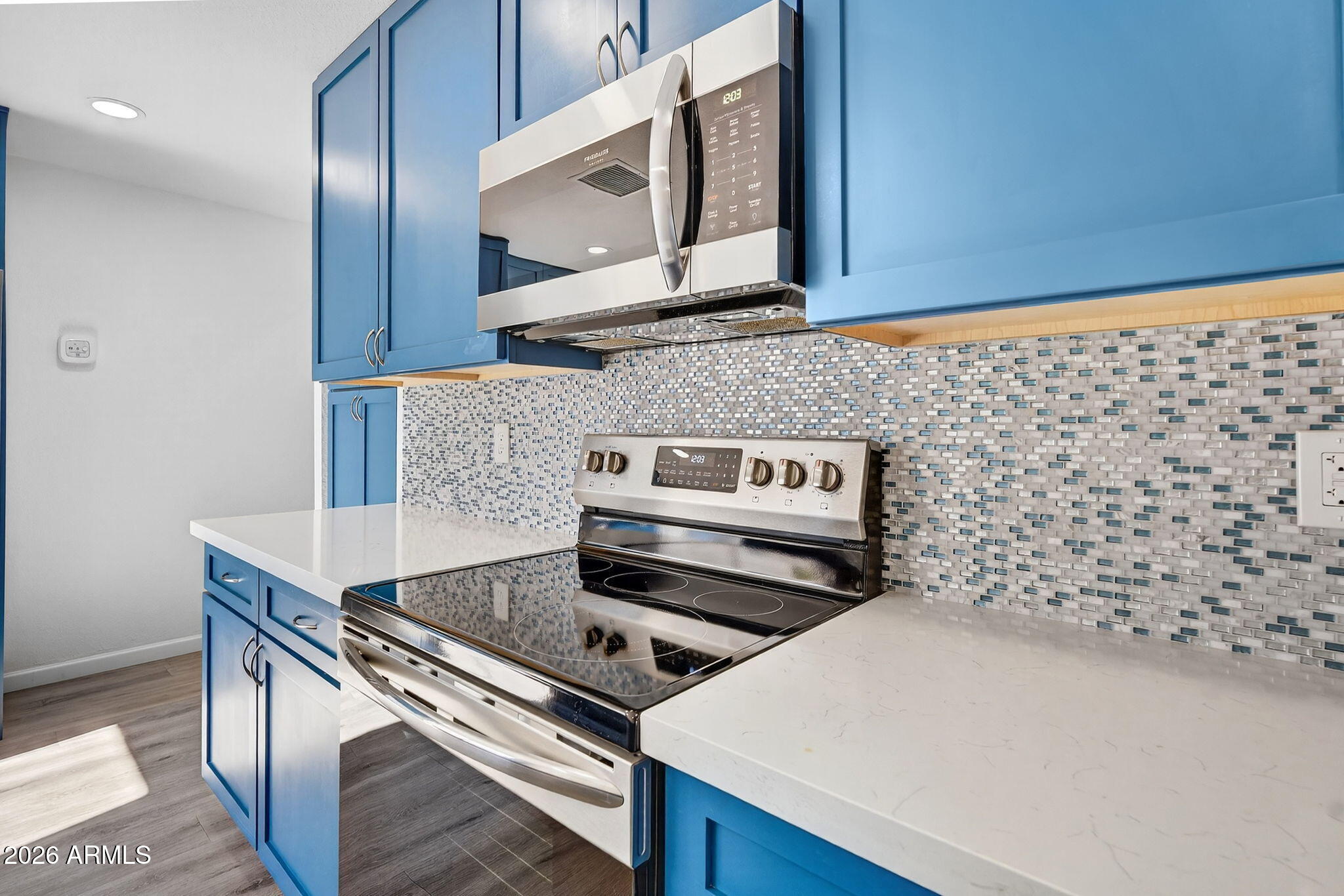 330 East Embassy Street Tempe, AZ 85288 - Photo 15 of 68 a stove top oven sitting inside of a kitchen