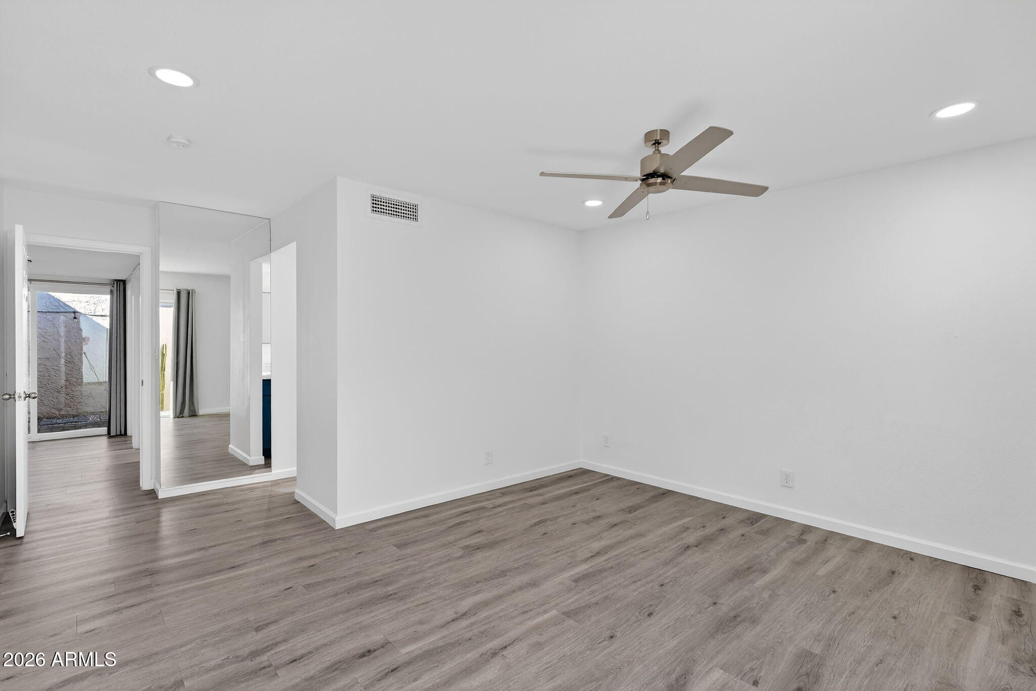 330 East Embassy Street Tempe, AZ 85288 - Photo 18 of 68 a view of a room with wooden floor and a ceiling fan