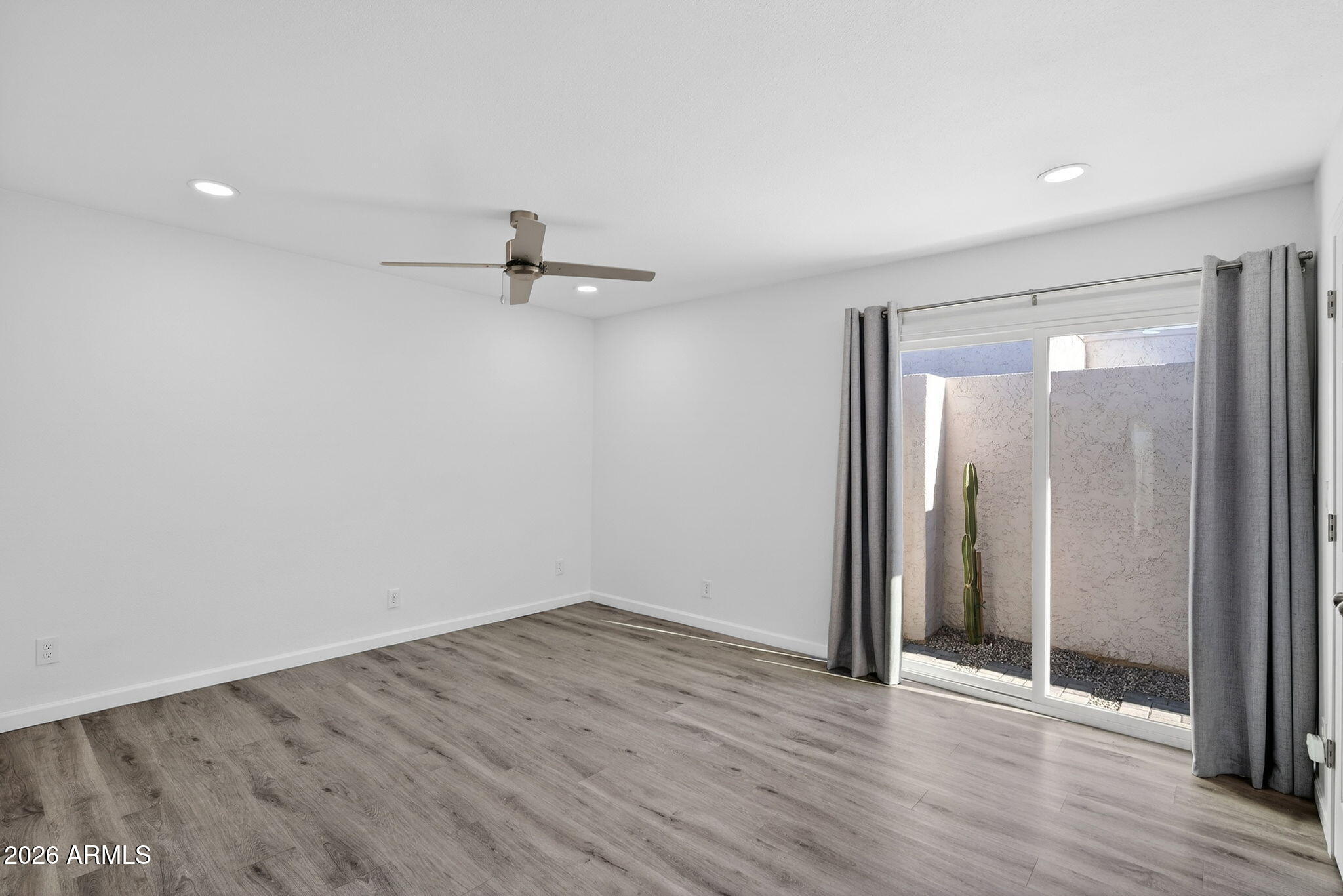 330 East Embassy Street Tempe, AZ 85288 - Photo 20 of 68 wooden floor in an empty room with a window