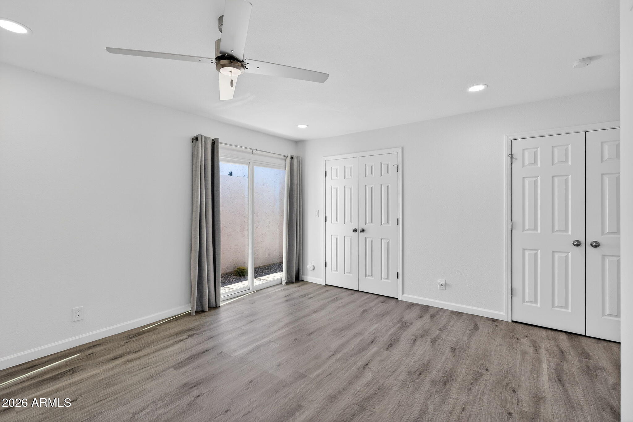 330 East Embassy Street Tempe, AZ 85288 - Photo 22 of 68 a view of an empty room with wooden floor