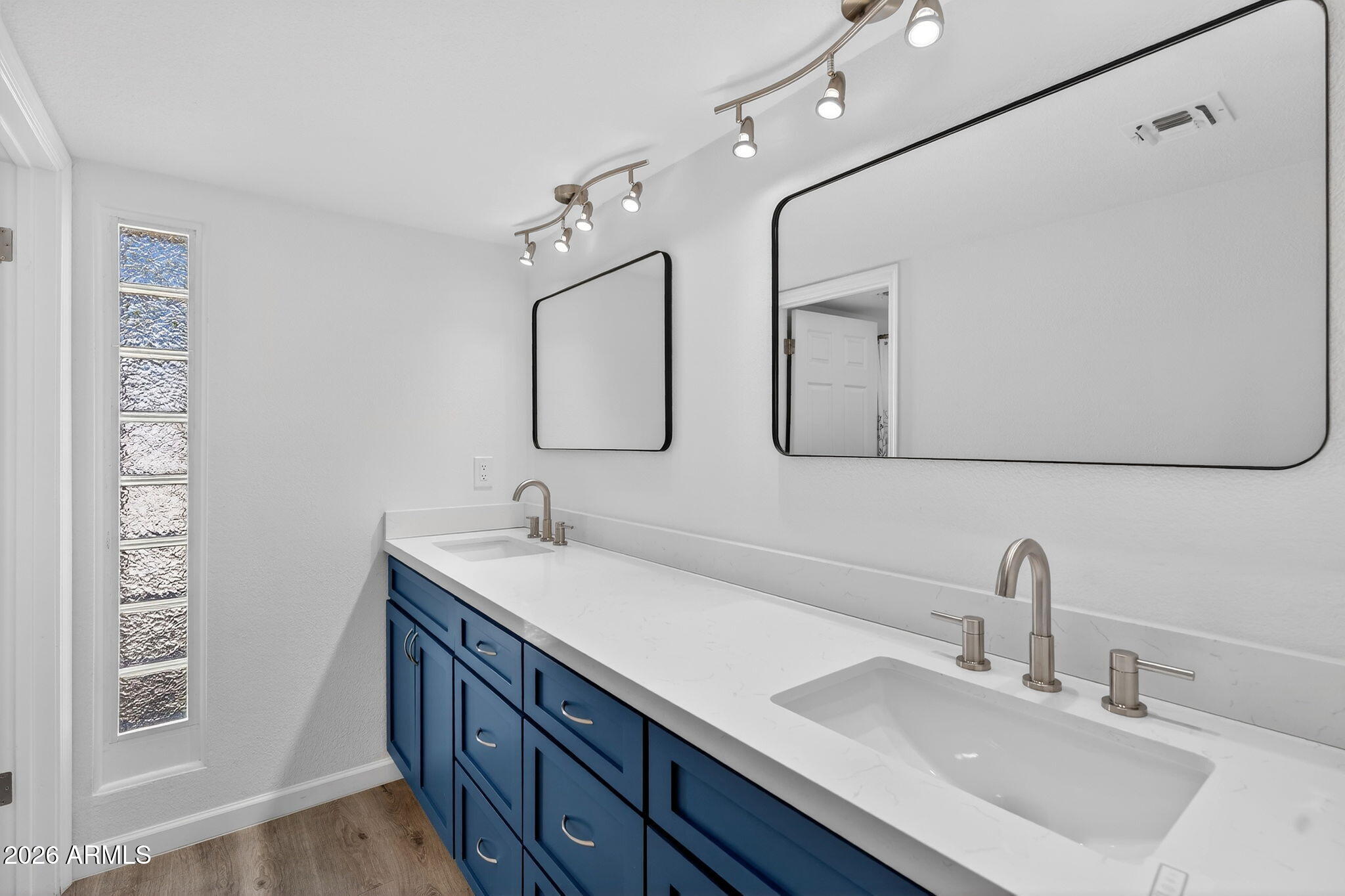 330 East Embassy Street Tempe, AZ 85288 - Photo 23 of 68 a bathroom with a double vanity sink mirror and