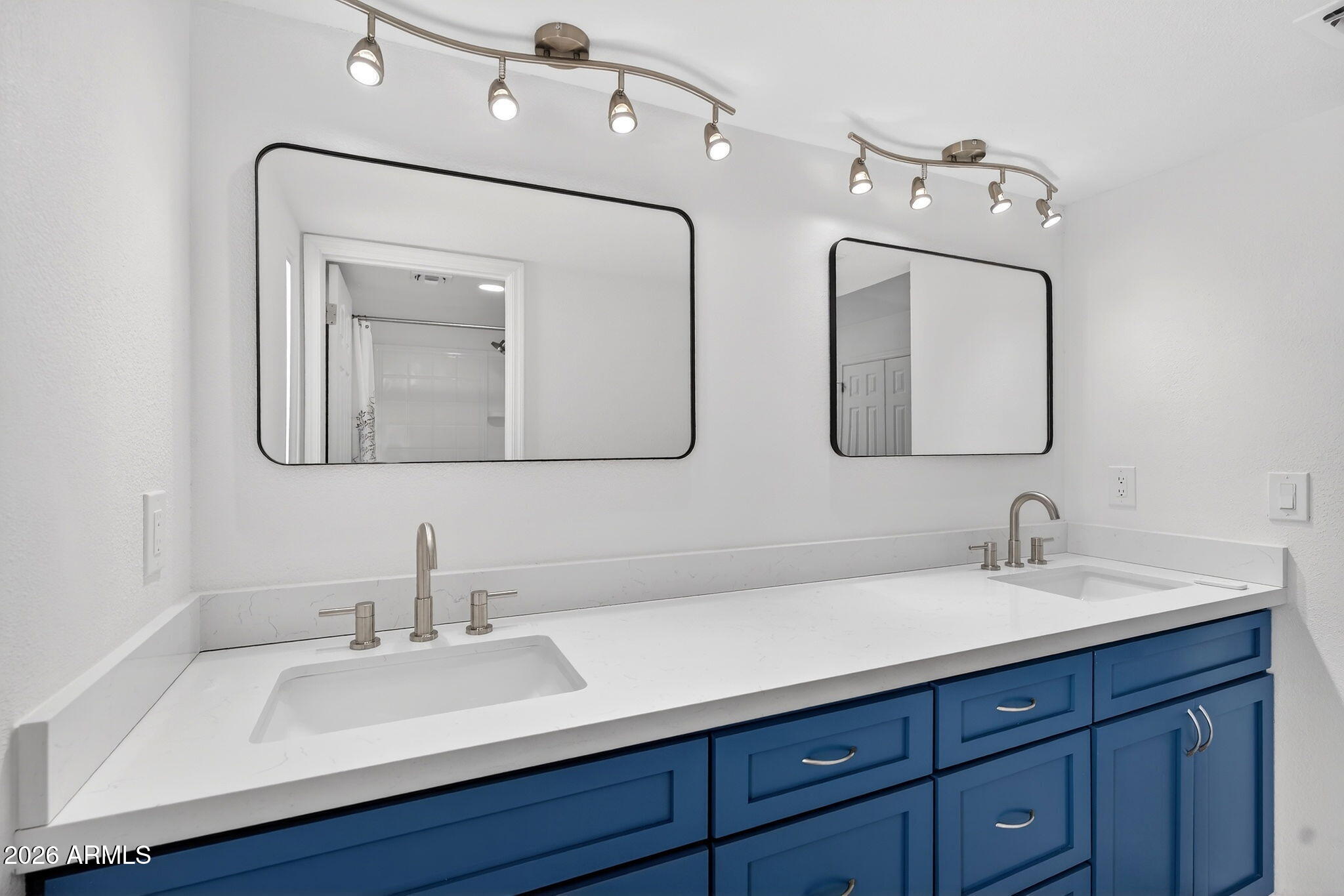 330 East Embassy Street Tempe, AZ 85288 - Photo 24 of 68 a bathroom with double vanity sinks and a mirror