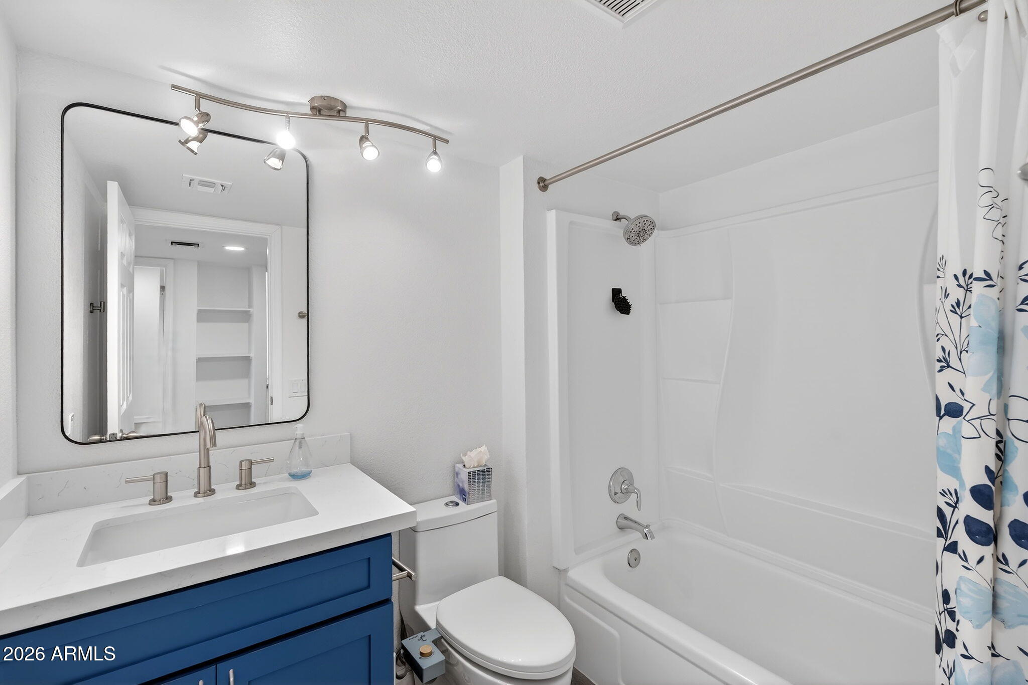 330 East Embassy Street Tempe, AZ 85288 - Photo 35 of 68 a bathroom with a sink toilet a mirror and shower