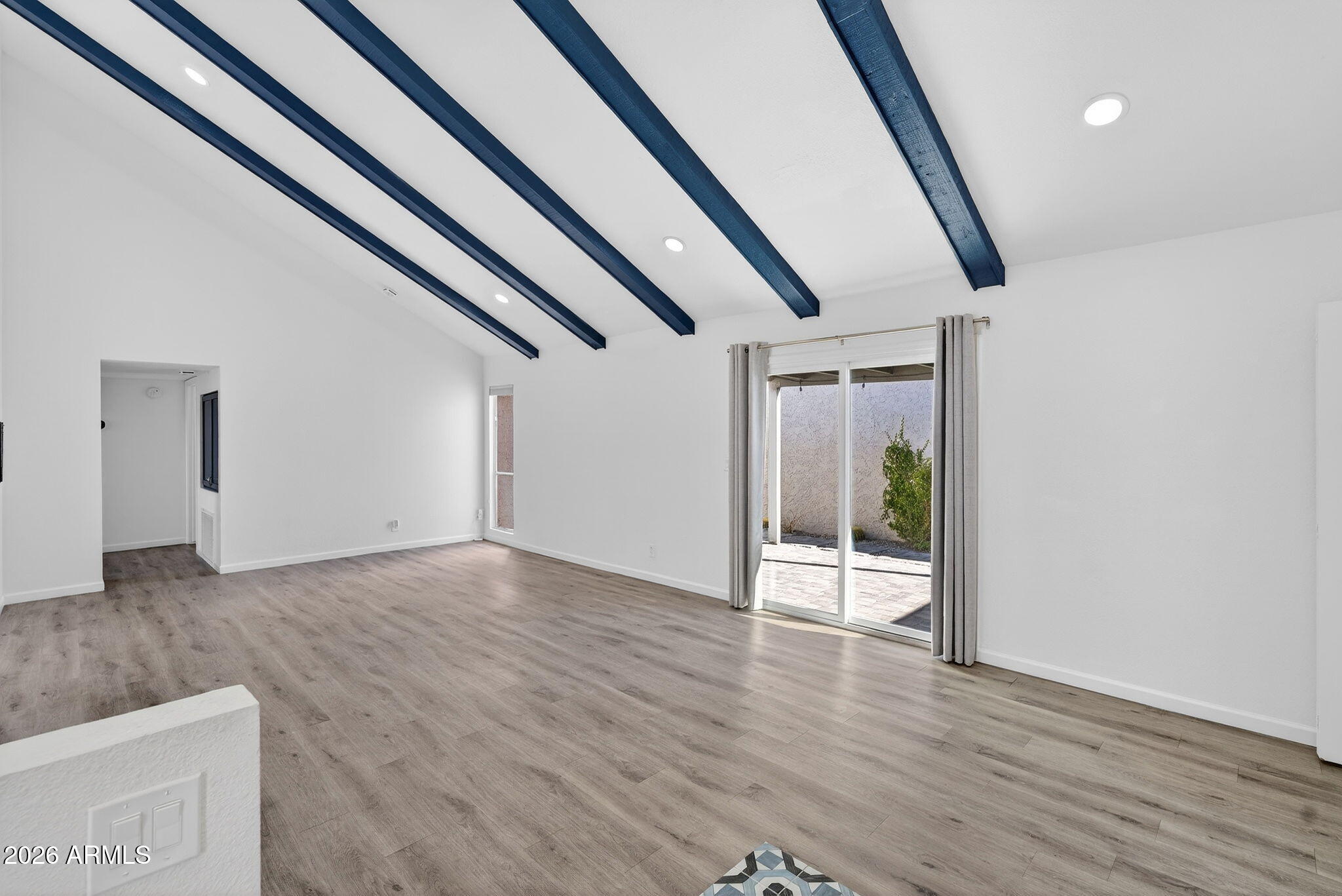 330 East Embassy Street Tempe, AZ 85288 - Photo 5 of 68 a view of an empty room with wooden floor and stairs