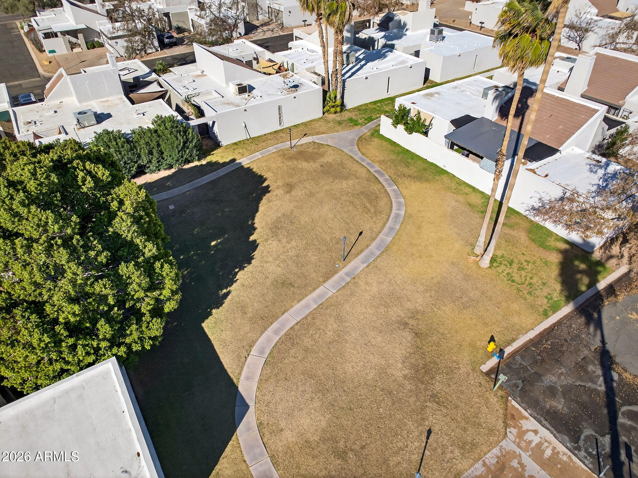 330 East Embassy Street Tempe, AZ 85288 - Photo 65 of 68 an aerial view of a house with a yard and pool