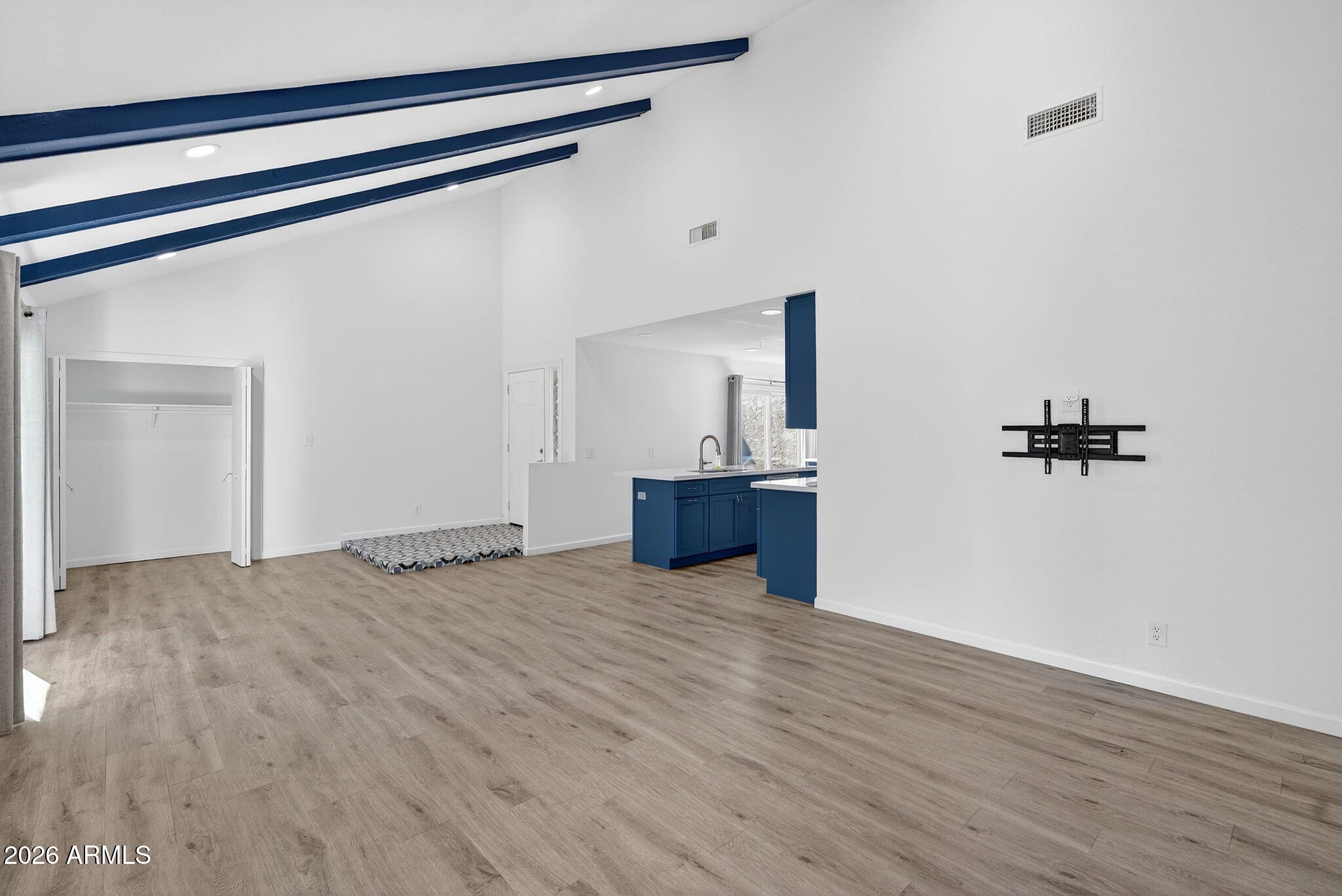 330 East Embassy Street Tempe, AZ 85288 - Photo 7 of 68 a view of a room with wooden floor and a ceiling fan