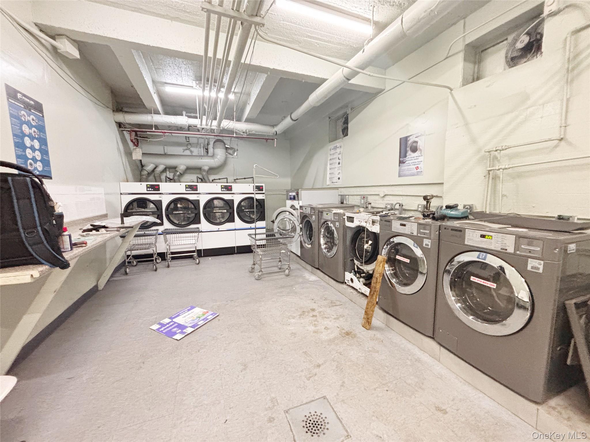 44-25 Macnish Street, Unit 4A Queens, NY 11373 - Photo 12 of 12 Communal laundry room featuring washer and clothes dryer