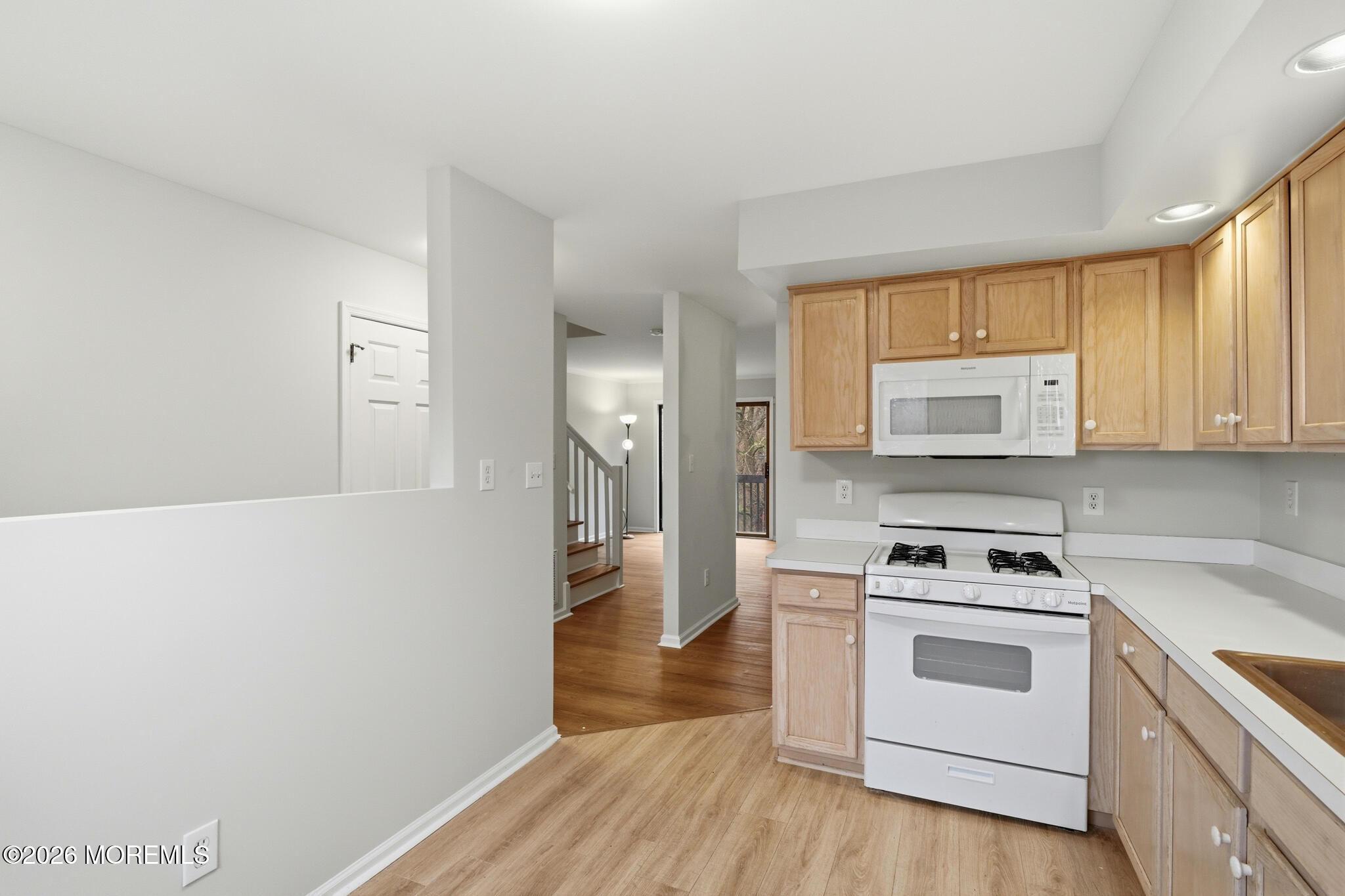 1606 Alpine Trail Neptune Township, NJ 07753 - Photo 13 of 33 a kitchen with a stove a sink and a refrigerator