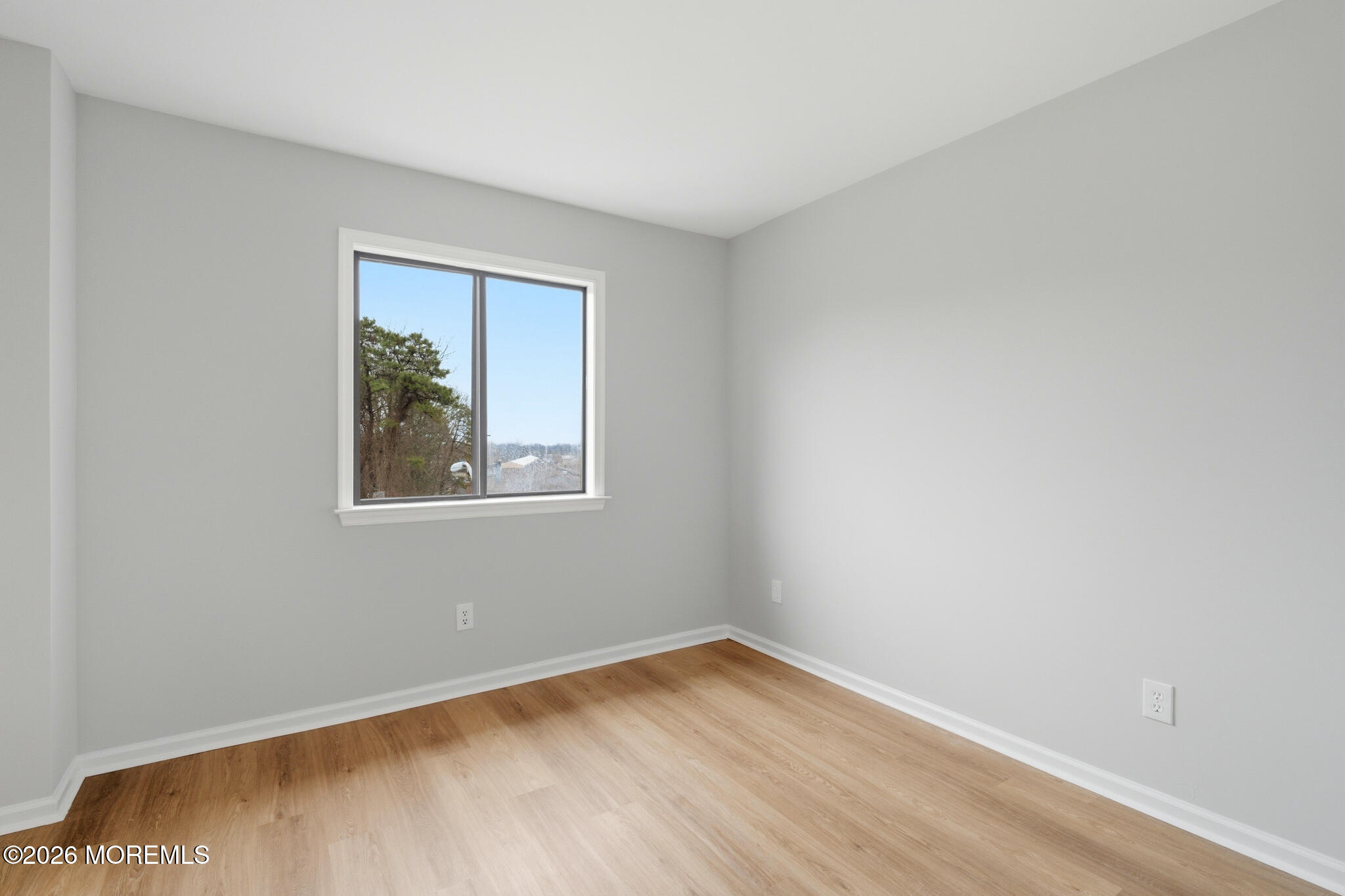 1606 Alpine Trail Neptune Township, NJ 07753 - Photo 15 of 33 a view of an empty room with wooden floor and a window