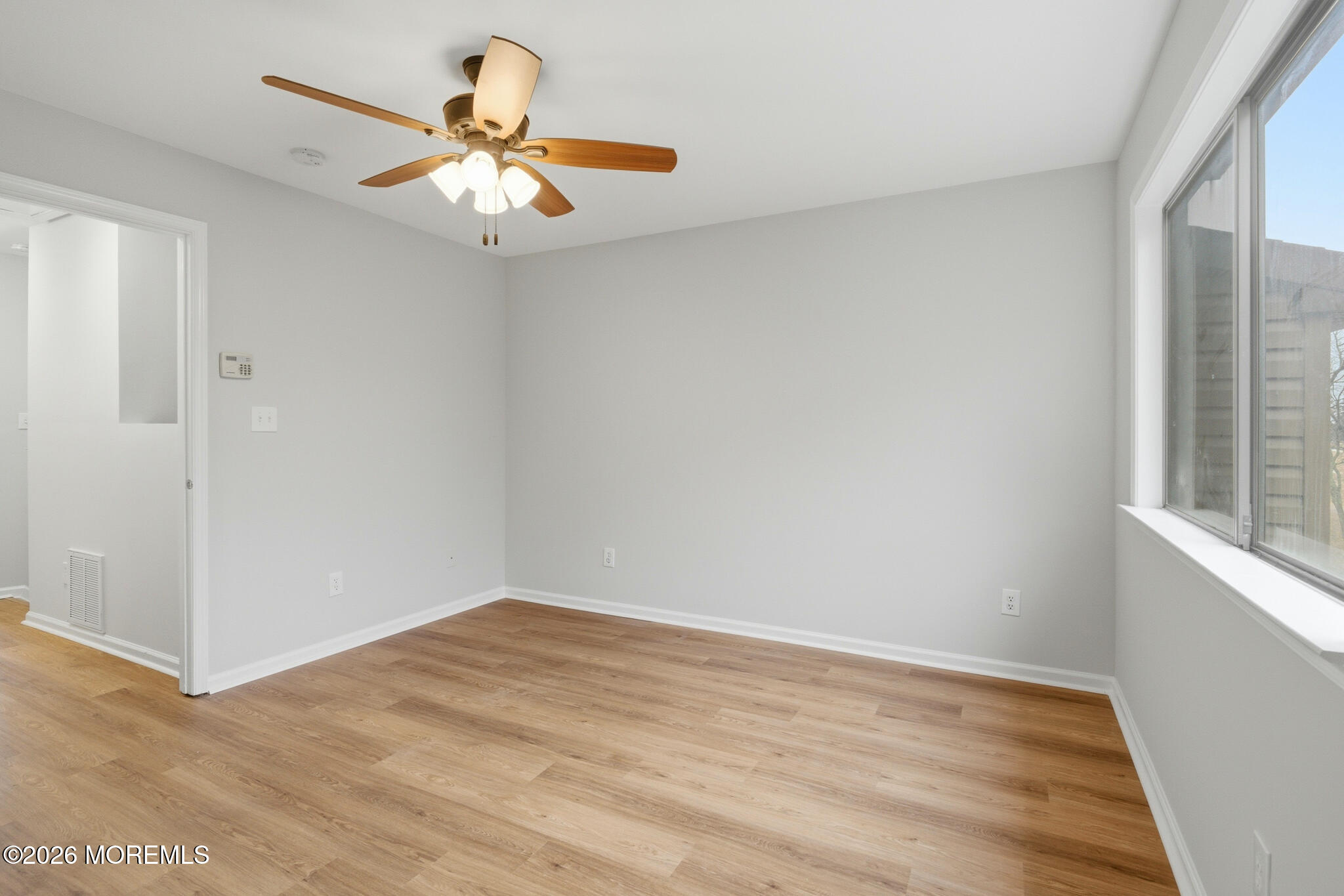 1606 Alpine Trail Neptune Township, NJ 07753 - Photo 20 of 33 a view of empty room with wooden floor and fan