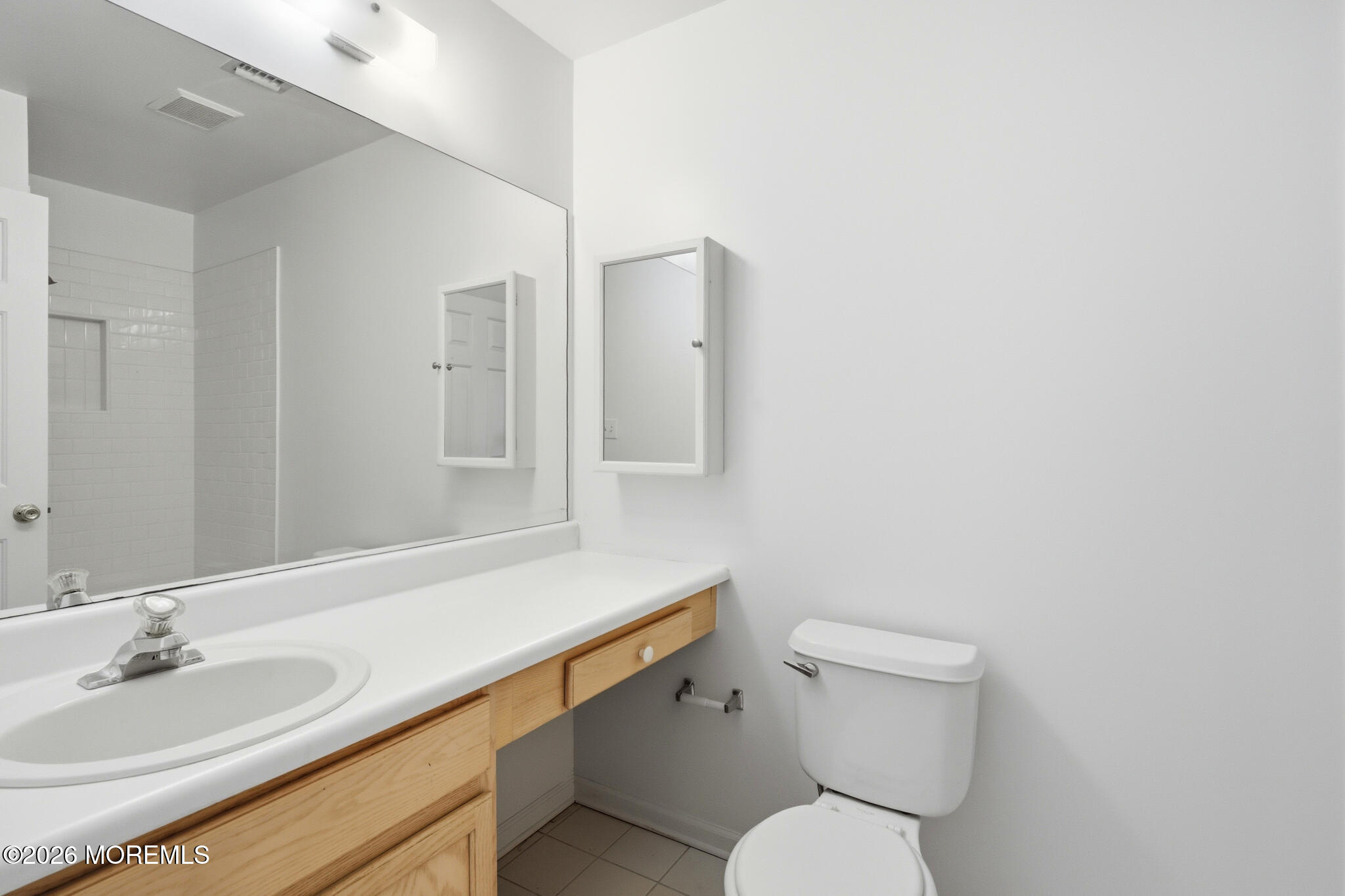 1606 Alpine Trail Neptune Township, NJ 07753 - Photo 22 of 33 a bathroom with a toilet sink and mirror