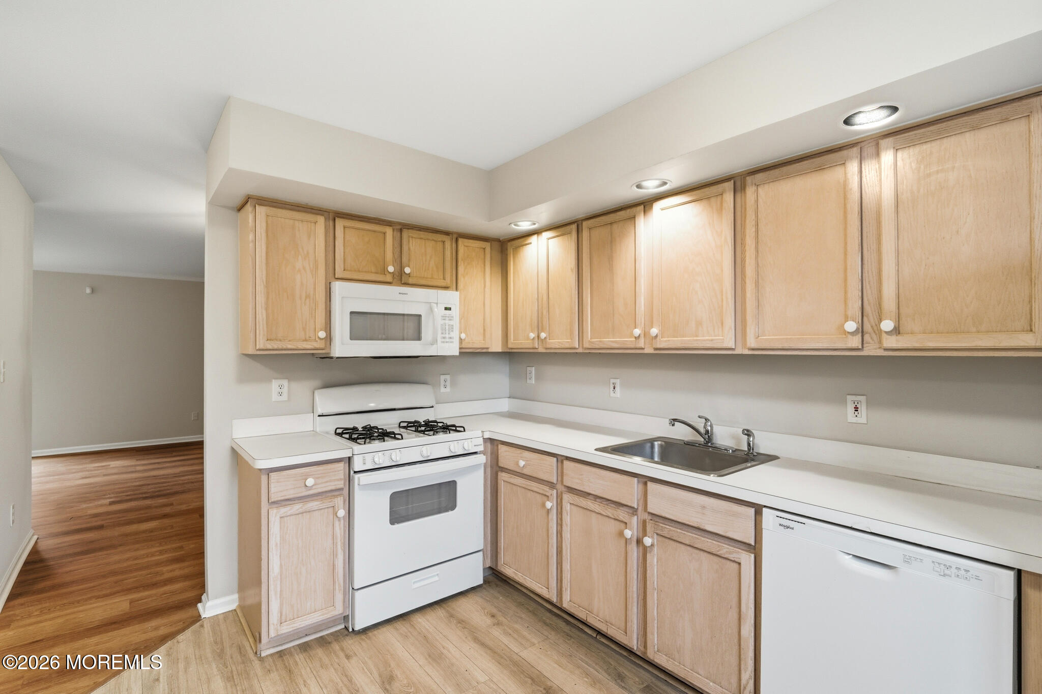 1606 Alpine Trail Neptune Township, NJ 07753 - Photo 29 of 33 a kitchen with white cabinets and white appliances