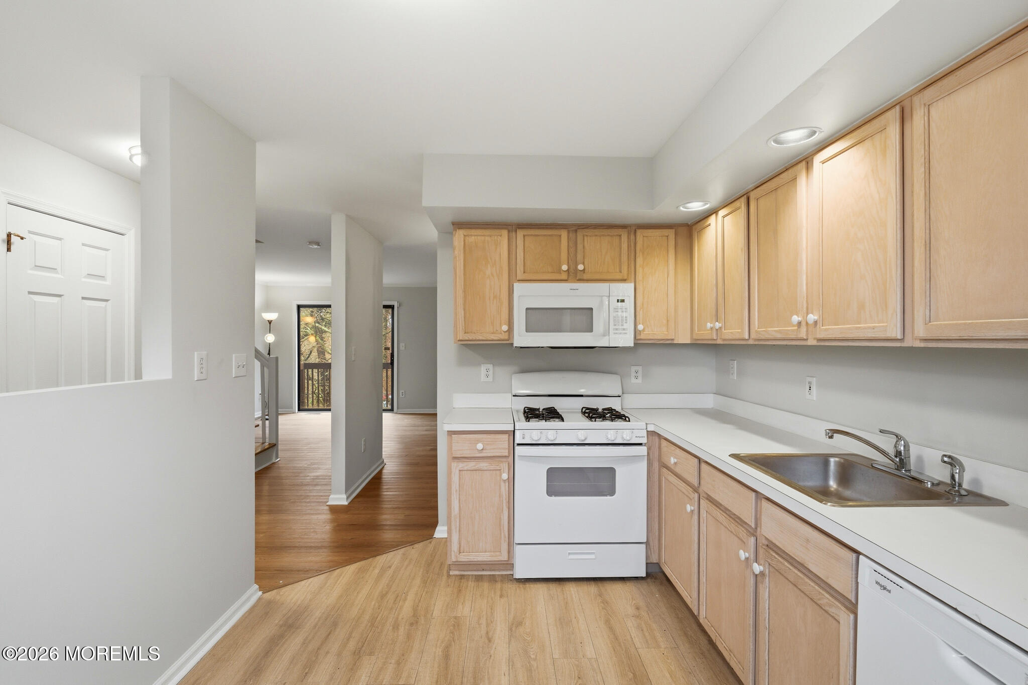 1606 Alpine Trail Neptune Township, NJ 07753 - Photo 30 of 33 a kitchen with granite countertop a sink a counter top space stainless steel appliances and cabinets