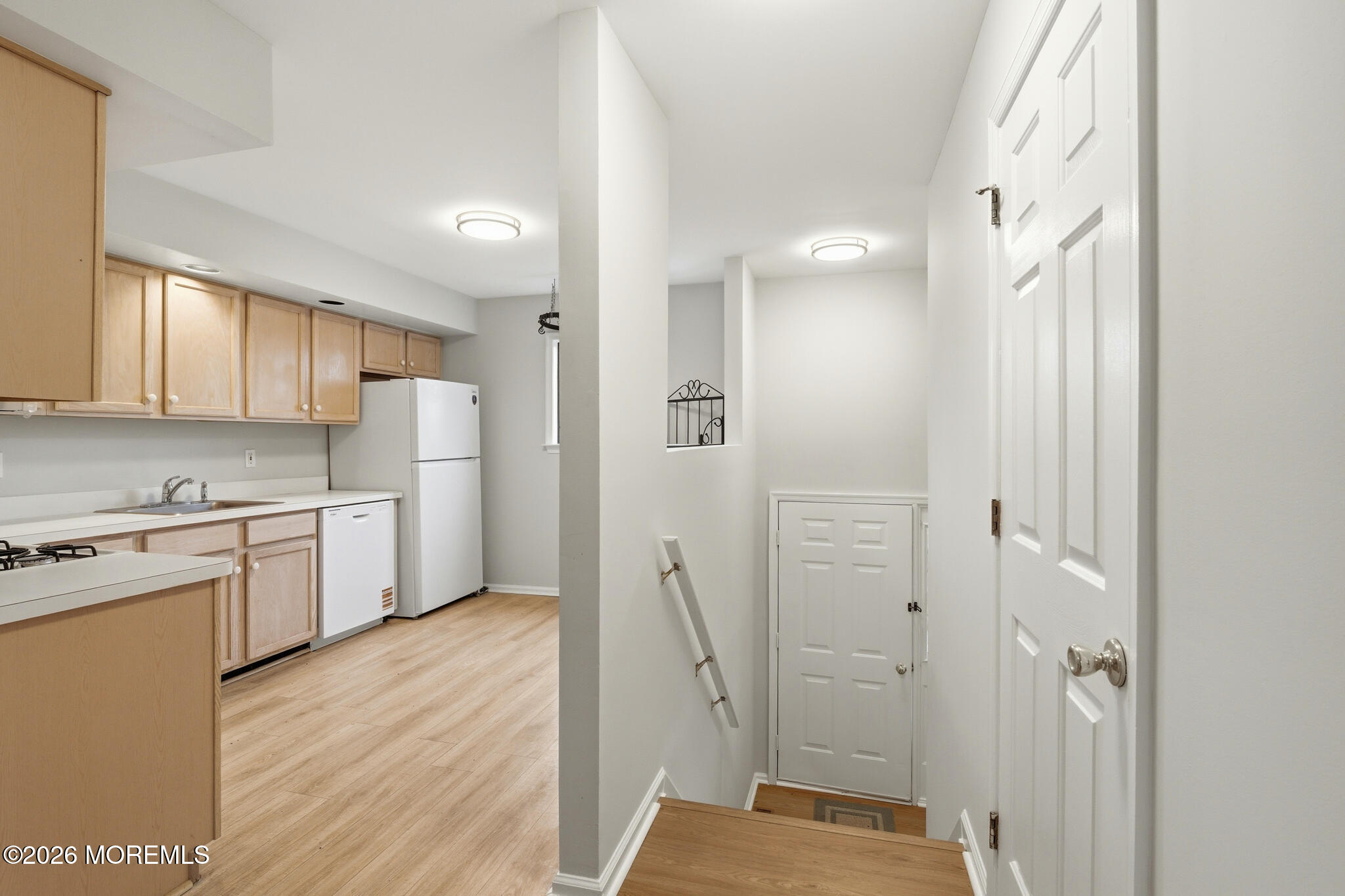 1606 Alpine Trail Neptune Township, NJ 07753 - Photo 3 of 33 a kitchen with a refrigerator a sink and cabinets