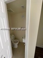 1680 Northwest 4th Avenue, Unit 8B Miami, FL 33136 - Photo 6 of 9 a toilet sitting in a bathroom next to a sink