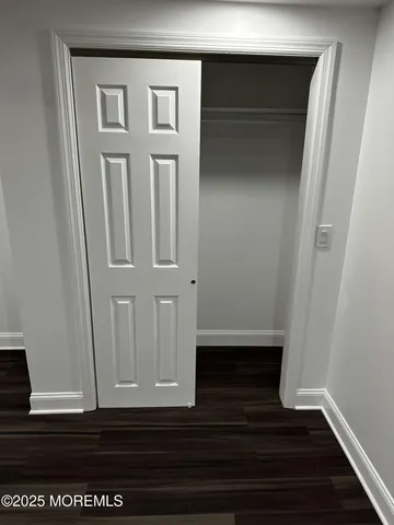 a bathroom with a bathtub sink vanity mirror and toilet