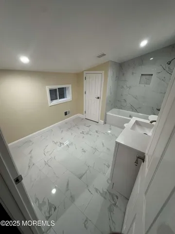 a view of room with wooden floor