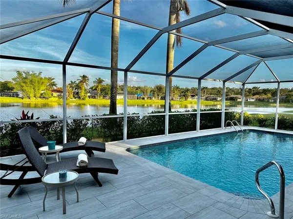 a view of a swimming pool with a patio