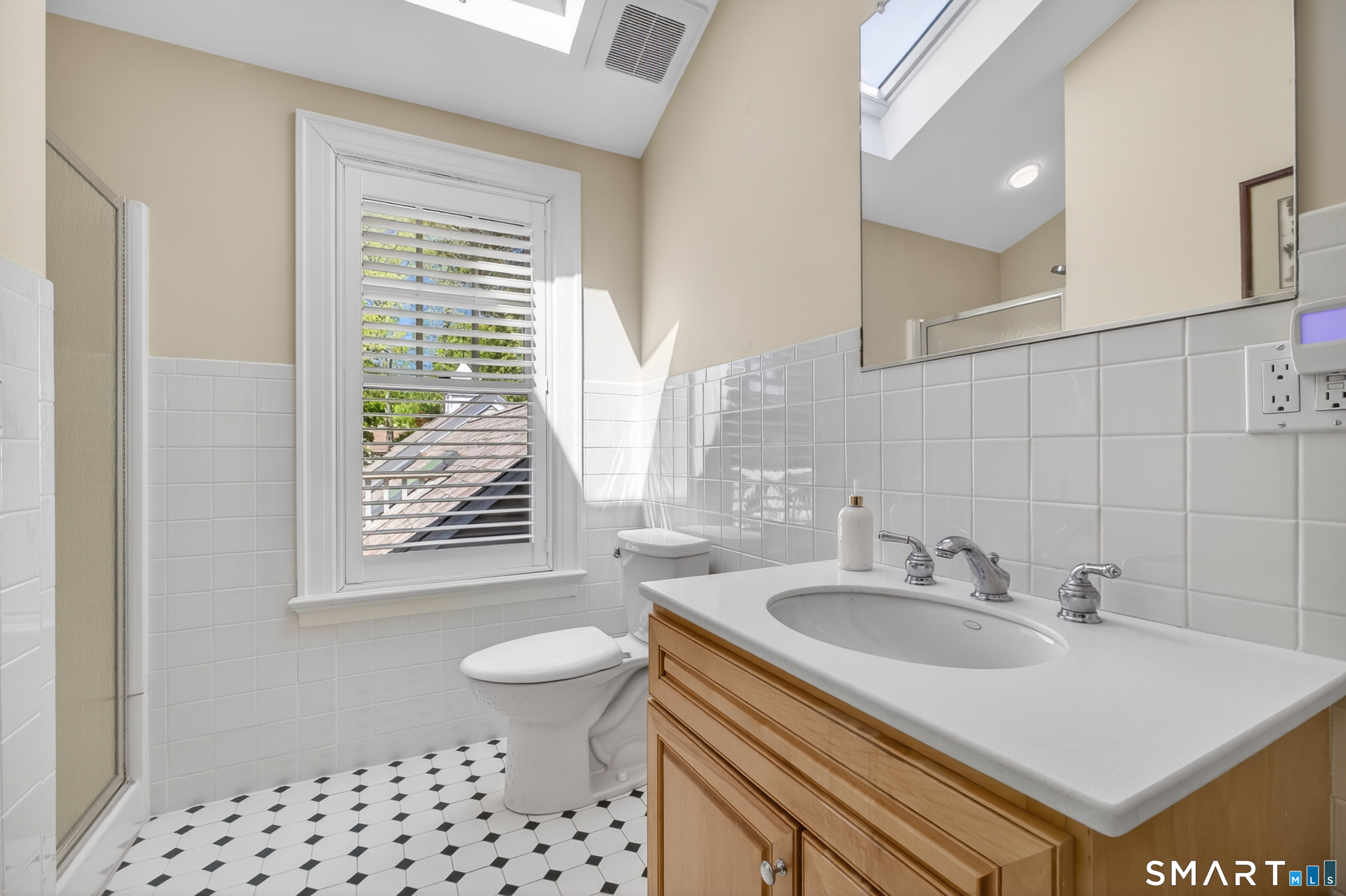 10 Prospect Street Groton, CT 06355 - Photo 37 of 40 a bathroom with a sink vanity granite toilet and a shower