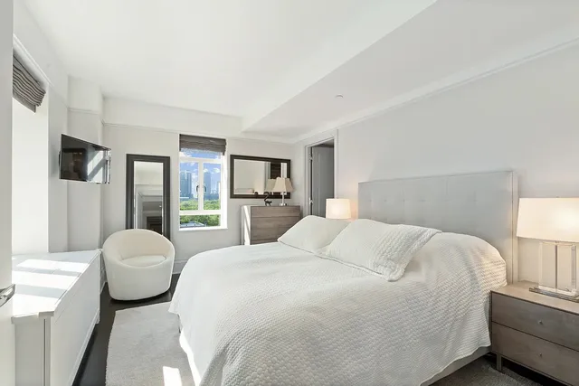 a bedroom with a bed and a couch