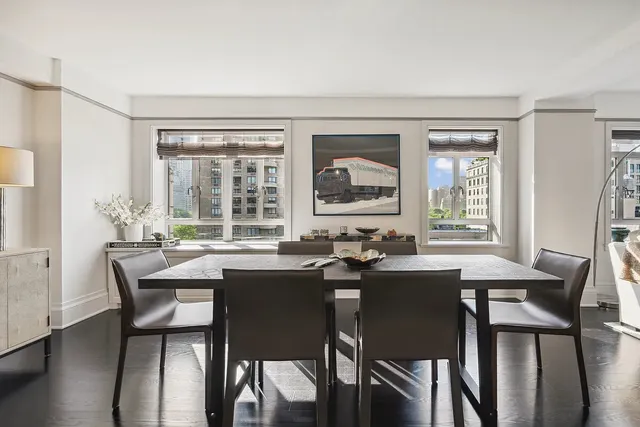 a dining room with furniture and window