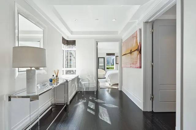 a room with table chairs and wooden floor