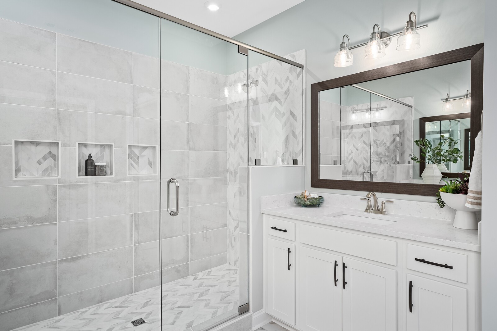 7689 Hatcher Heights Drive Fairview, TN 37062 - Photo 30 of 47 a bathroom with a shower sink and mirror